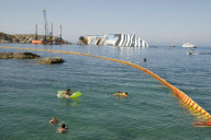 Bathers on beach of Scalettino near the wreck of Costa Concordia, Isola Del Giglio, Italy - 07 Jul 2012