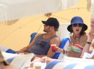 Twilight'' star Kellan Lutz spends a day on the beach with super thin girlfriend Sharni Vinson. The two played in the waves and relaxed in a small area surrounded by umbrellas. Kellan took time to pose for a photo with a young fan before heading off the b