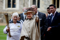   The Queen and The Duke of Edinburgh with the Olympic Torch  at Windsor Castle 100712