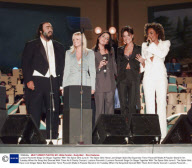 Luciano Pavarotti Sings On Stage Together With The Spice Girls June 9. The Spice Girls Have Lost Ginger Spice But Superstar Tenor Pavarotti Made A Popular Stand-in On Tuesday When He Sang And Danced With Them At A Charity Concert. Luciano Pavarotti (