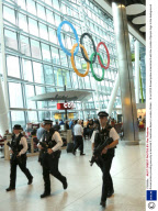 Armed police providing security at terminal 5, Heathrow Airport, London, Britain - 16 Jul 2012