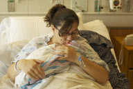 Aurora shooting victim gives birth