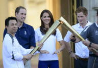 Olympic Torch Relay passes through Buckingham Palace, London, Britain - 26 Jul 2012