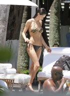 Italian musician Eros Ramazzotti relaxes poolside in Miami, Florida on August 12, 2012 