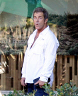 Mel Gibson clashes with photographers while out with daughter