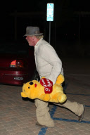 Nick Nolte carrying a large teddy bear at the Malibu Chili Cook Off