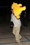 Nick Nolte carrying a large teddy bear at the Malibu Chili Cook Off