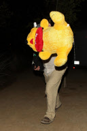 Nick Nolte carrying a large teddy bear at the Malibu Chili Cook Off