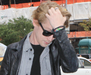 Macaulay Culkin smoking with painted nails in NYC
