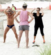 Kourtney Kardashian working up a sweat on the beach