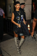 Rihanna Signs Autographs for Fans as she Leaves a Building in Soho