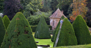 Patrick Cooke, who spends two weeks trimming 12, 30ft high yew tree pyramids at Athelhampton House, Dorset, Britain - 04 Oct 2012