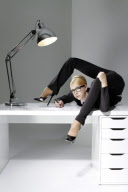 Think YOU are being overstretched in the office? Female contortionist brings new meaning to the term flexible working in incredible calendar shoot
