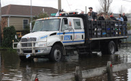 Breezy Point residents tour destroyed homes