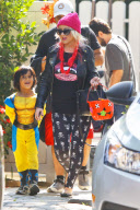 Christina Aguilera and Jordan Bratman separately leaving Max's school Halloween party