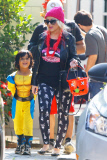 Christina Aguilera and Jordan Bratman separately leaving Max's school Halloween party