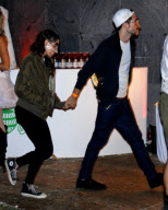 Robert Pattinson and Kristen Stewart holding hands at a Halloween Party