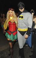Paris Hilton and River Viiperi play superheros at a Halloween party