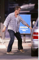 Actor MEL GIBSON giving the paparazzi a big smile after getting a haircut in Malibu