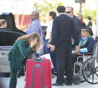 Quincy Jones Gets Pushed In A Wheelchair At LAX