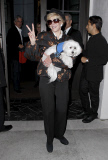 Jane Fonda and her pup attending David Geffen's party at Spago