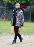 Heidi Klum looking sad while at her son's flag football game on a rainy Saturday