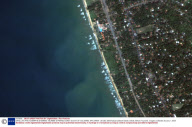 SATELLITE PHOTOGRAPHS SHOWING TSUNAMI STRIKING COAST SOUTH OF COLOMBO, SRI LANKA - 26 DEC 2004