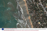 SATELLITE PHOTOGRAPHS SHOWING TSUNAMI STRIKING COAST SOUTH OF COLOMBO, SRI LANKA - 26 DEC 2004