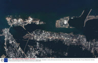 SATELLITE PHOTOGRAPHS SHOWING TSUNAMI HITTING CITY OF BANDA ACEH, INDONESIA - 26 DEC 2004