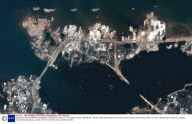 SATELLITE PHOTOGRAPHS SHOWING TSUNAMI HITTING CITY OF BANDA ACEH, INDONESIA - 26 DEC 2004