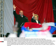 PARIS: Jacques Chirac and his wife Bernadette salute the crowd at Paris's Place de l