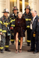 Sharon Stone Poses with the FDNY on her way to the Fading Gigalo Set