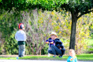 CORRECTED CAPTION: Julie Bowen Spends An Afternoon At The Park With Her Boys
