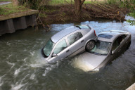 Two cars stuck in River Cam after owners ignored warnings and tried to cross flooded ford, Hinxton, Essex, Britain - 10 Dec 2012