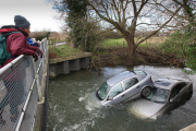 Two cars stuck in River Cam after owners ignored warnings and tried to cross flooded ford, Hinxton, Essex, Britain - 10 Dec 2012