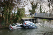 Two cars stuck in River Cam after owners ignored warnings and tried to cross flooded ford, Hinxton, Essex, Britain - 10 Dec 2012