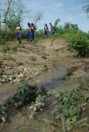 Children forced to cross rivers and walk on muddy paths to get to school, Indonesia - 14 Dec 2012
