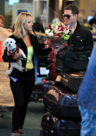 *EXCLUSIVE* Michael Bublé greets his wife with flowers at Vancouver Airport [NO Canada]