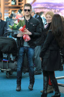 *EXCLUSIVE* Michael Bublé greets his wife with flowers at Vancouver Airport [NO Canada]