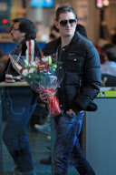 *EXCLUSIVE* Michael Bublé greets his wife with flowers at Vancouver Airport [NO Canada]