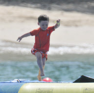 Coleen Rooney and Kai at the beach