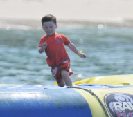 Coleen Rooney and Kai at the beach