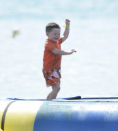 Coleen Rooney and Kai at the beach