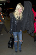 Tara Reid looks frazzled at LAX
