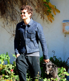 A Happy Orlando Bloom Leaves A Friends House With His Pup