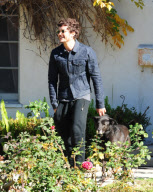 A Happy Orlando Bloom Leaves A Friends House With His Pup