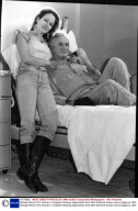 Michael Winner Film Director In Hospital Following Appendicitis Here With Girlfriend Actress Jenny Seagrove 1987.