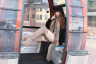 *EXCLUSIVE* Phoebe Price wears bikini under fur coat in Park City - Part 2