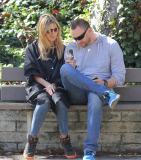 Heidi Klum's Halloween picture is printed on the custom case of Martin Kristen's phone