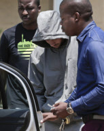 Oscar Pistorius leaves Boschkop Police Station, Pretoria, South Africa - 14 Feb 2013
